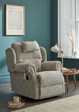 Load image into Gallery viewer, Grey recliner chair in a room with teal walls, a lamp, and a small table.