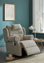 Load image into Gallery viewer, Grey recliner chair in a living room with teal walls and a window.
