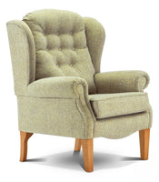 Green upholstered armchair with wooden legs on a white background