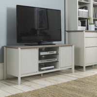 TV on a wooden stand in a living room setting