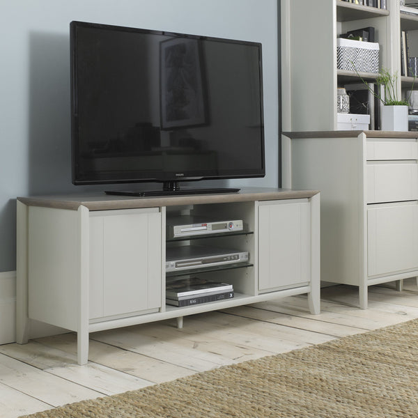 TV on a wooden stand in a living room setting