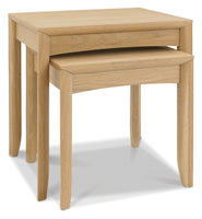 Set of two wooden nesting tables on a white background
