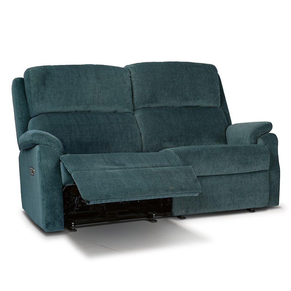 Reclining denim blue sofa with a white background