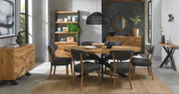 Dining room with wooden furniture, table, and chairs.
