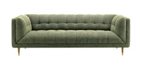 A modern three-seater sofa upholstered in textured olive green fabric, featuring channel tufting on the backrest and seat, with tapered gold metal legs, shown against a plain white background.