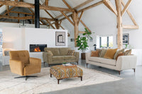 Modern living room with wooden beams, a fireplace, and comfortable furniture.