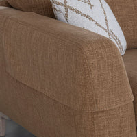 Brown textured sofa with a decorative pillow