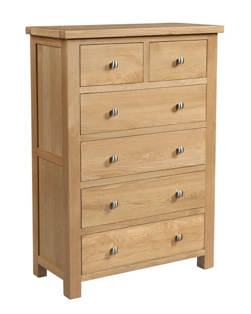 Wooden dresser with multiple drawers on a white background