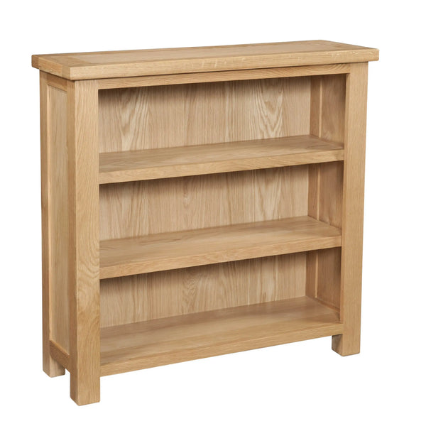 Wooden bookshelf with three shelves on a white background