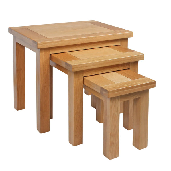 Set of three wooden nesting tables on a white background