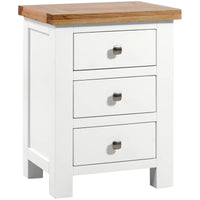 White dresser with three drawers and a wooden top on a white background