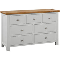 Gray dresser with wooden top on a white background