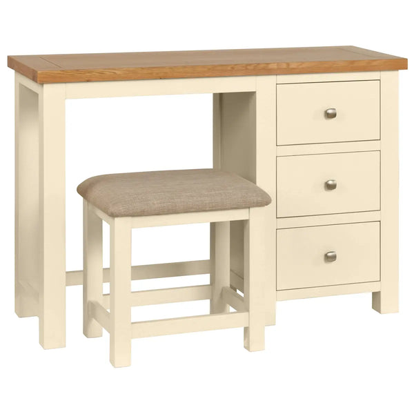 Beige dressing table with two drawers and a matching stool on a white background