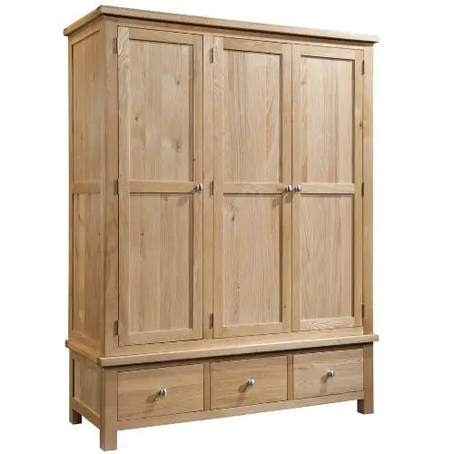 Wooden wardrobe with three doors and three drawers on a white background