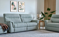 Light grey sofa in a living room with decorative elements.