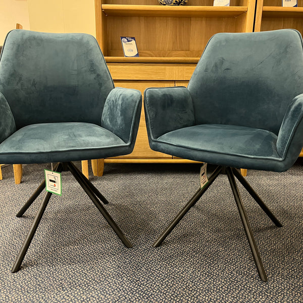 Two blue chairs with black legs