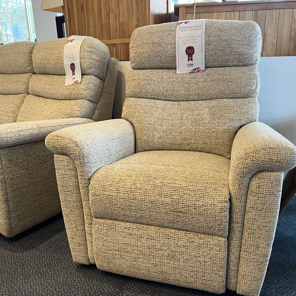 Beige recliner chair in a showroom setting
