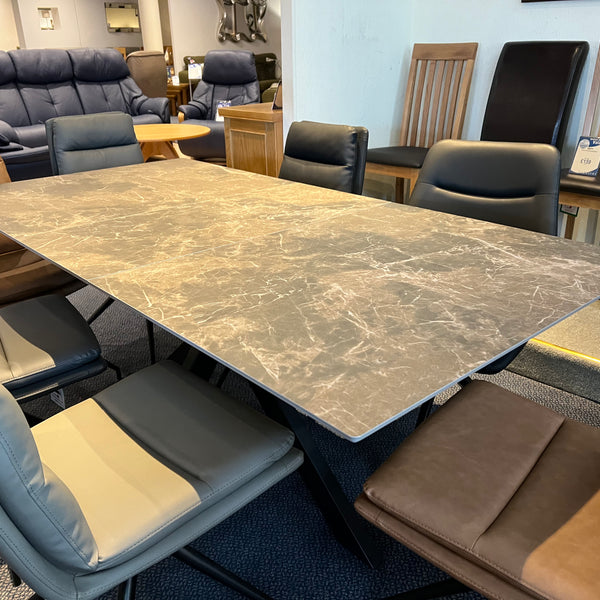 Dining table with chairs in a furniture store setting
