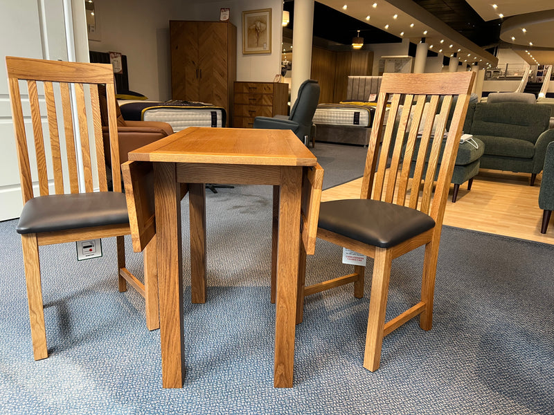 Dorset rustic oak drop leaf table and two chairs