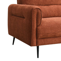Rust upholstered chair with black legs on a white background