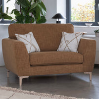 Brown sofa with patterned cushions in a living room setting