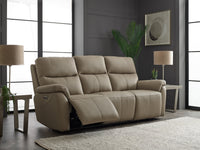 Beige reclining sofa in a modern living room with lamps and a plant.