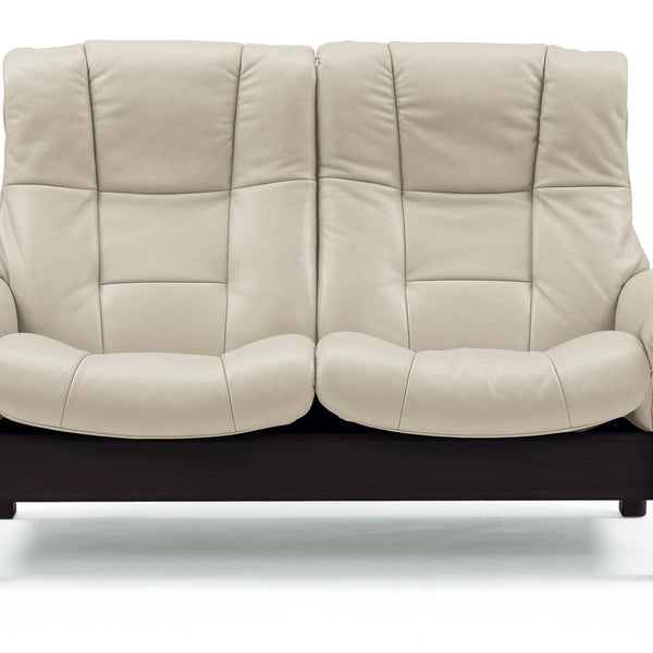 Cream  leather sofa with dark wooden frame on a white background