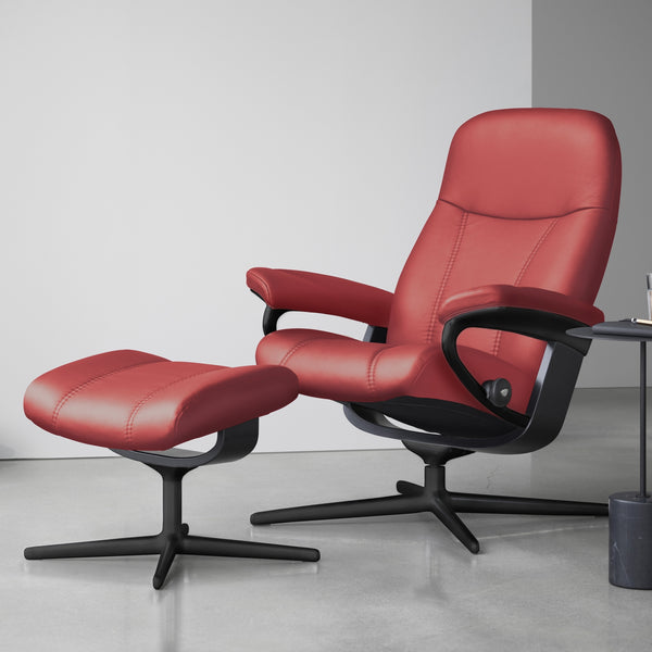 Red recliner chair with stool in a modern room setting
