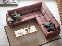 Sectional sofa with cushions and a coffee table in a living room setting