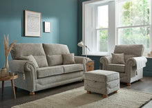 Load image into Gallery viewer, Grey sofa set in a living room with teal walls and large windows.
