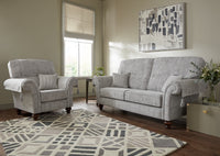 Living room with grey sofa and armchair on a patterned rug
