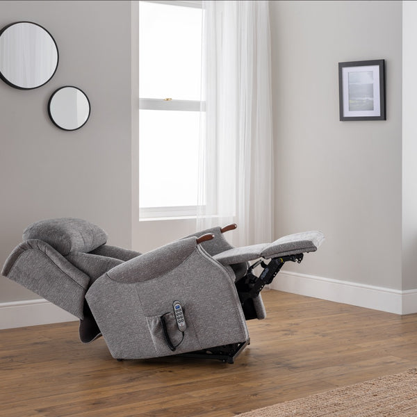 Grey recliner chair in a room with mirrors and a window.