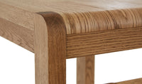 Close-up of a wooden table corner with a white background