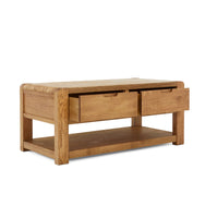 Wooden coffee table with two drawers on a white background
