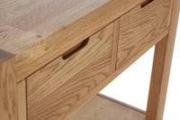 Close-up of a wooden desk with drawers on a white background