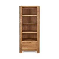 Wooden bookshelf with four shelves and a drawer on a white background