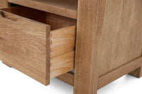Wooden drawer unit with a open drawer on a white background