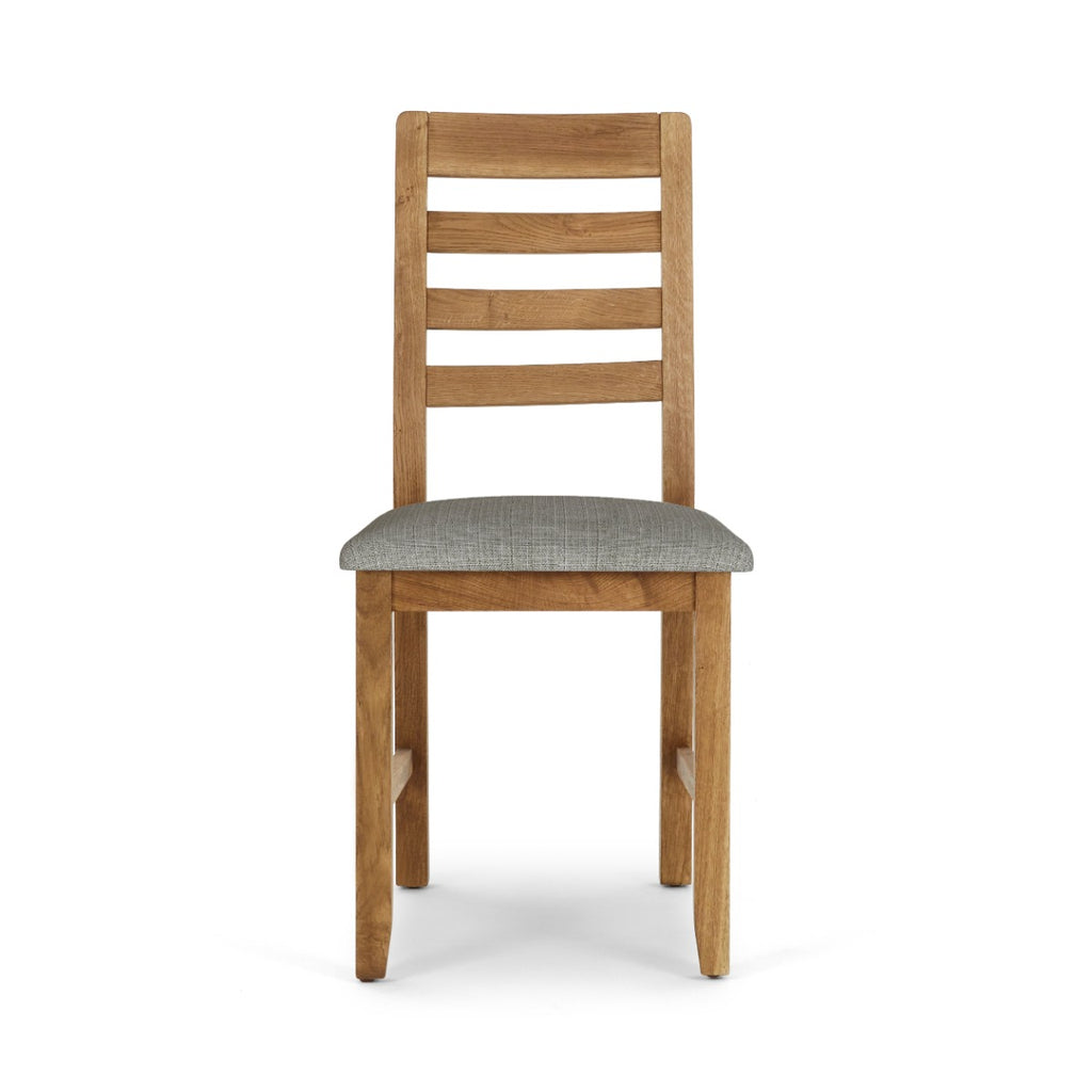 Wooden chair with a grey cushion on a white background