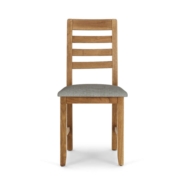 Wooden chair with a grey cushion on a white background