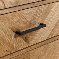 Wooden drawer with a black handle