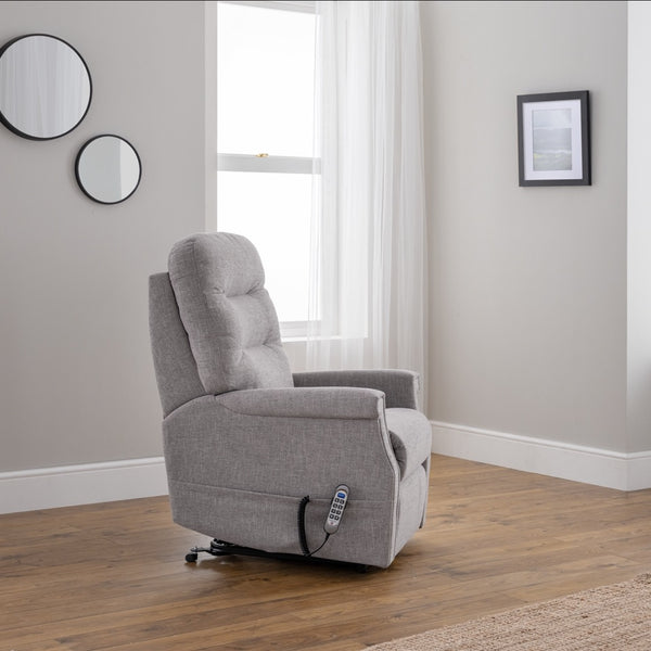 Grey recliner chair in a room with mirrors and a framed picture on the wall.