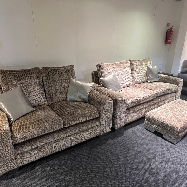 Crocodile brown and silver three seater, two seater sofa and footstool against a white wall