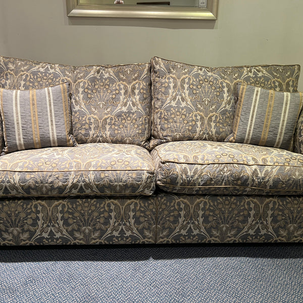 Patterned large sofa with two striped scatter cushions